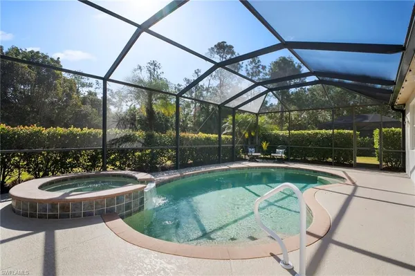 a view of a swimming pool with a patio