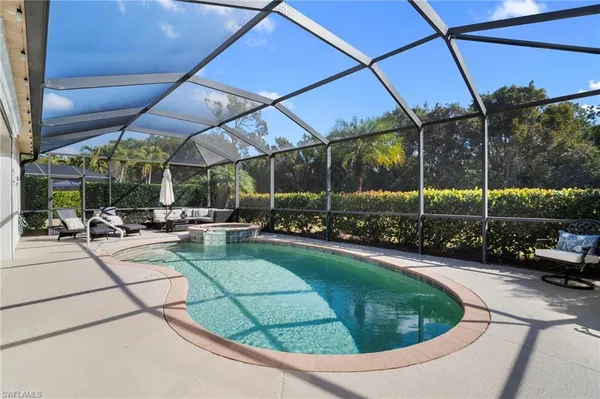 a view of a swimming pool with a patio