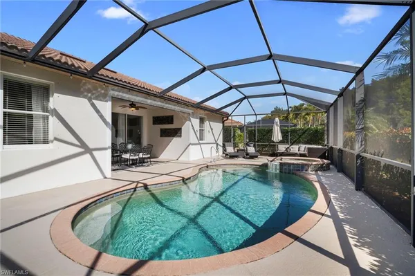 a view of a patio with couches chairs and a fire pit