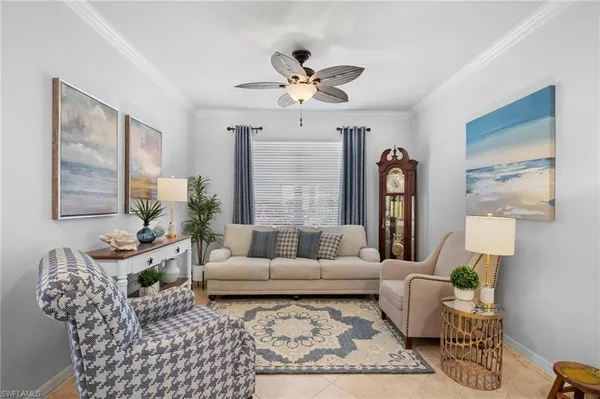 a living room with furniture and a dining table