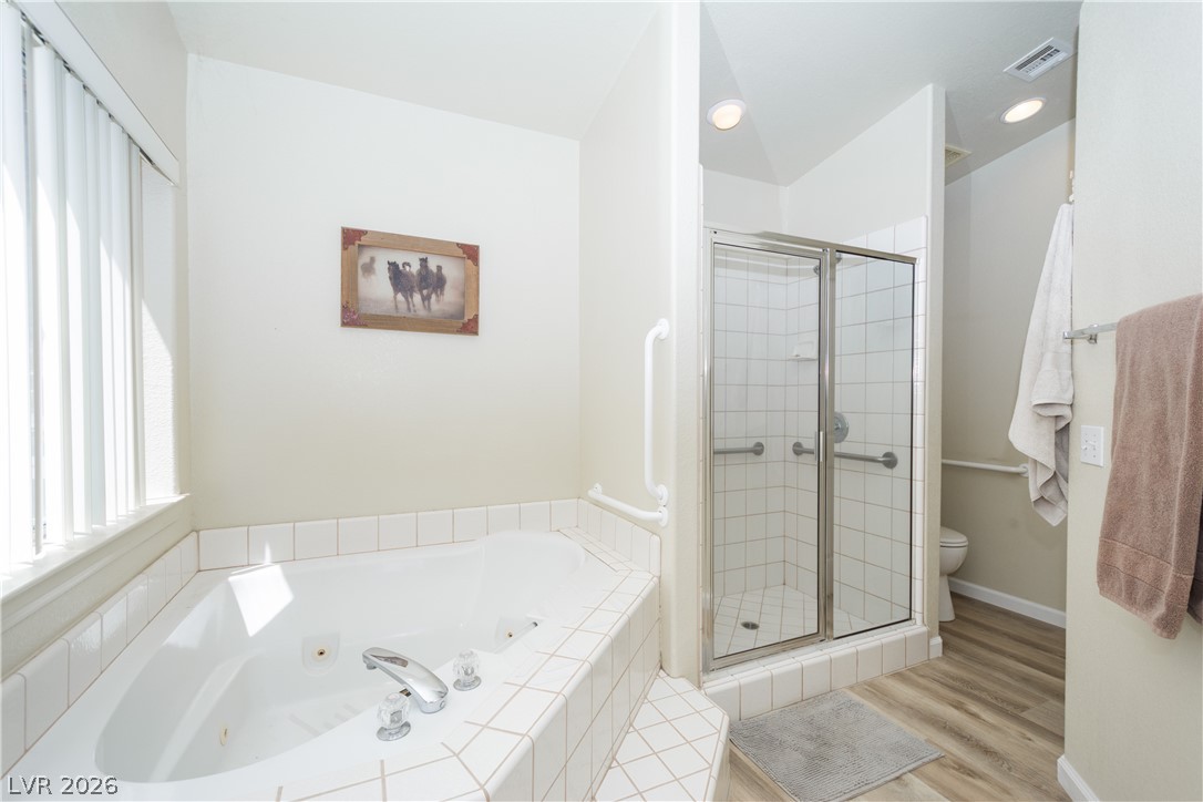 2381 Tough Boy Road Pahrump, NV 89060 - Photo 17 of 44 This bathroom offers both a soothing jetted tub and a convenient glass-enclosed shower.