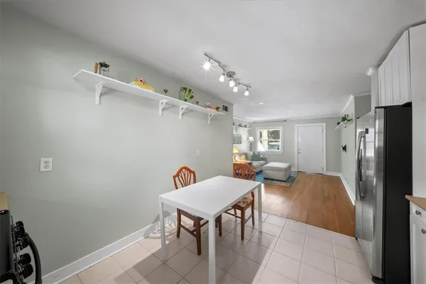 a outdoor space with lots of chairs and a refrigerator