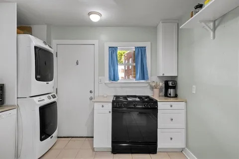 a kitchen with a stove and a refrigerator