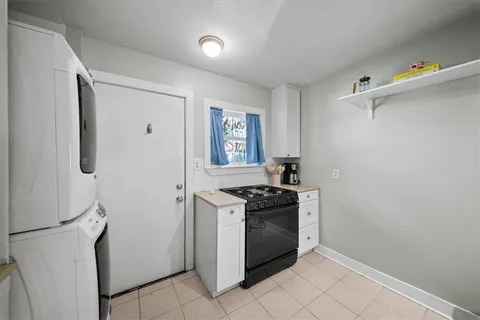 a kitchen with a stove and a refrigerator