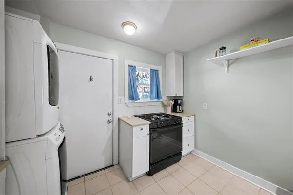a kitchen with a stove and a refrigerator