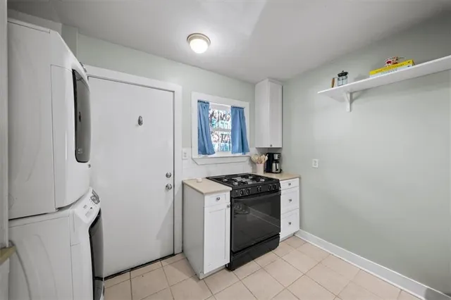 a kitchen with a stove and a refrigerator