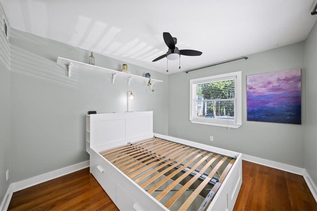 866 Briarcliff Road Northeast, Unit D2 Atlanta, GA 30306 - Photo 20 of 42 a view of an empty room with wooden floor and a window