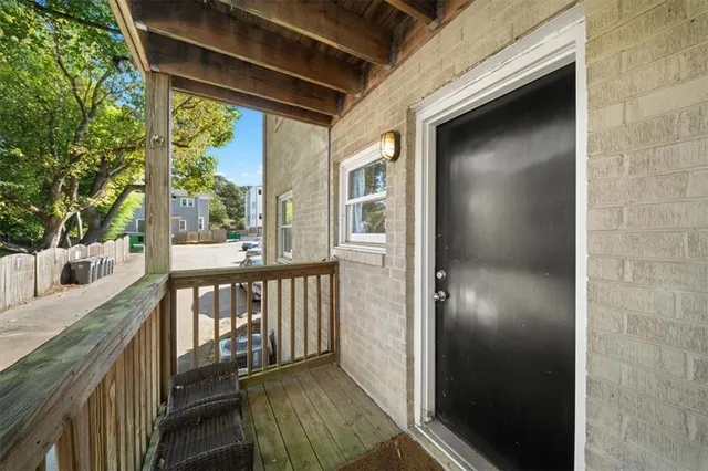 a view of a balcony with wooden floor