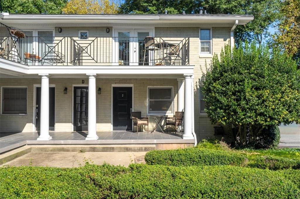 866 Briarcliff Road Northeast, Unit D2 Atlanta, GA 30306 - Photo 3 of 42 a view of a house with potted plants and a yard
