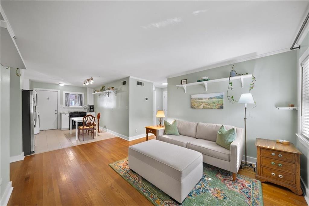 866 Briarcliff Road Northeast, Unit D2 Atlanta, GA 30306 - Photo 6 of 42 a living room with furniture and a wooden floor