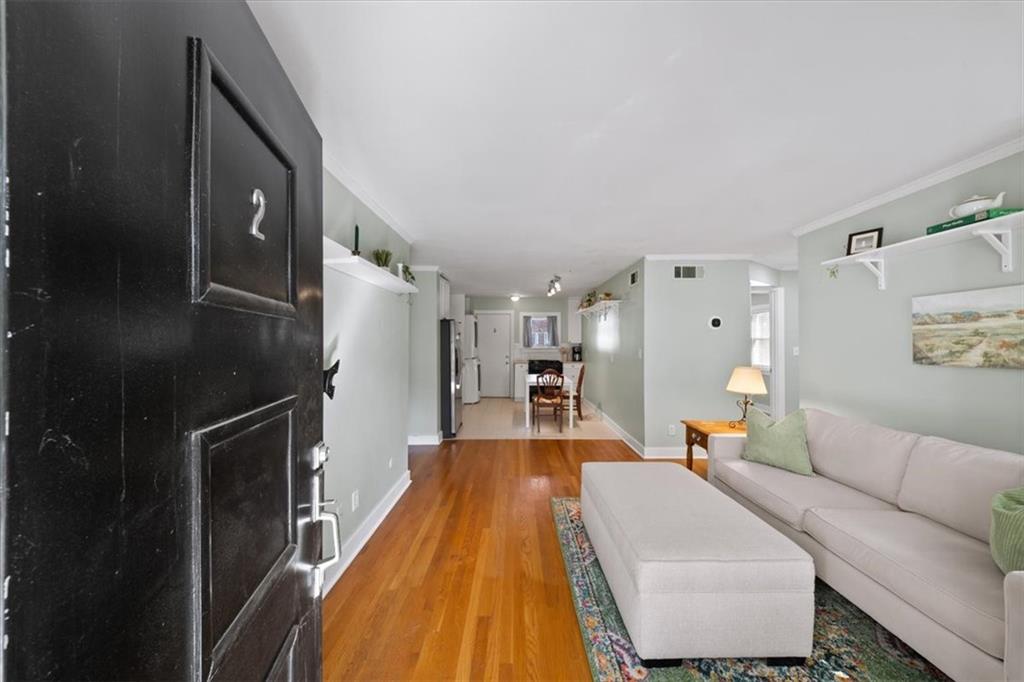 866 Briarcliff Road Northeast, Unit D2 Atlanta, GA 30306 - Photo 7 of 42 a living room with furniture and a fireplace