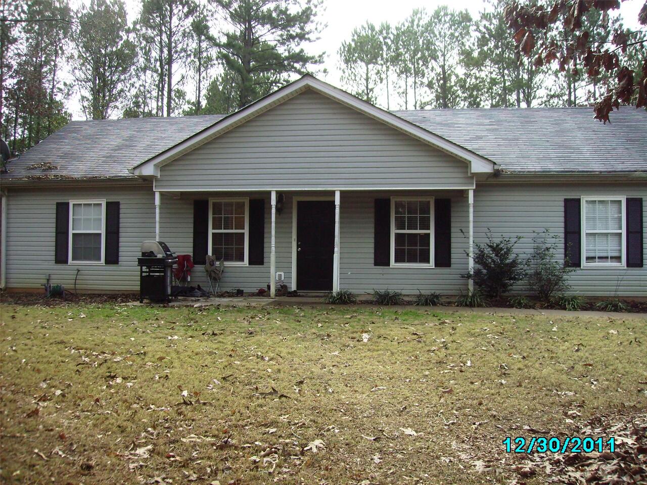 109 Robin Hood Road, Unit 9 Covington, GA 30014 - Photo 1 of 1 a view of a house with a yard