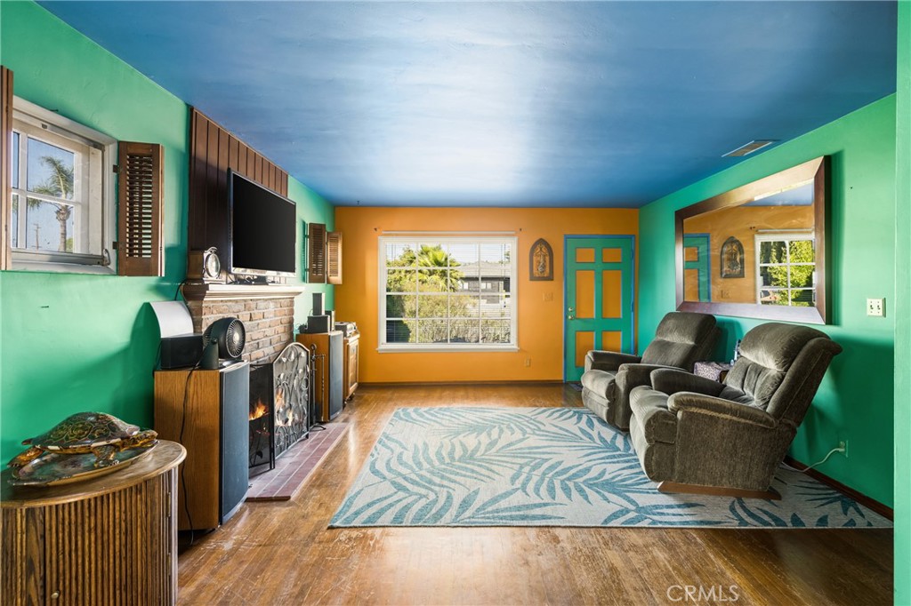 950 North Laurel Drive Orange, CA 92867 - Photo 8 of 34 a living room with furniture a flat screen tv and a fireplace