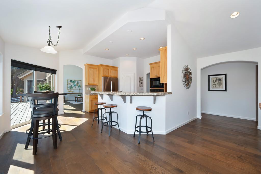 19676 Eagle Ridge Road Foresthill, CA 95631 - Photo 25 of 68 a view of a a dining room with furniture window and wooden floor