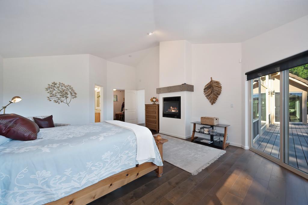 19676 Eagle Ridge Road Foresthill, CA 95631 - Photo 30 of 68 a bedroom with a large bed and a large window