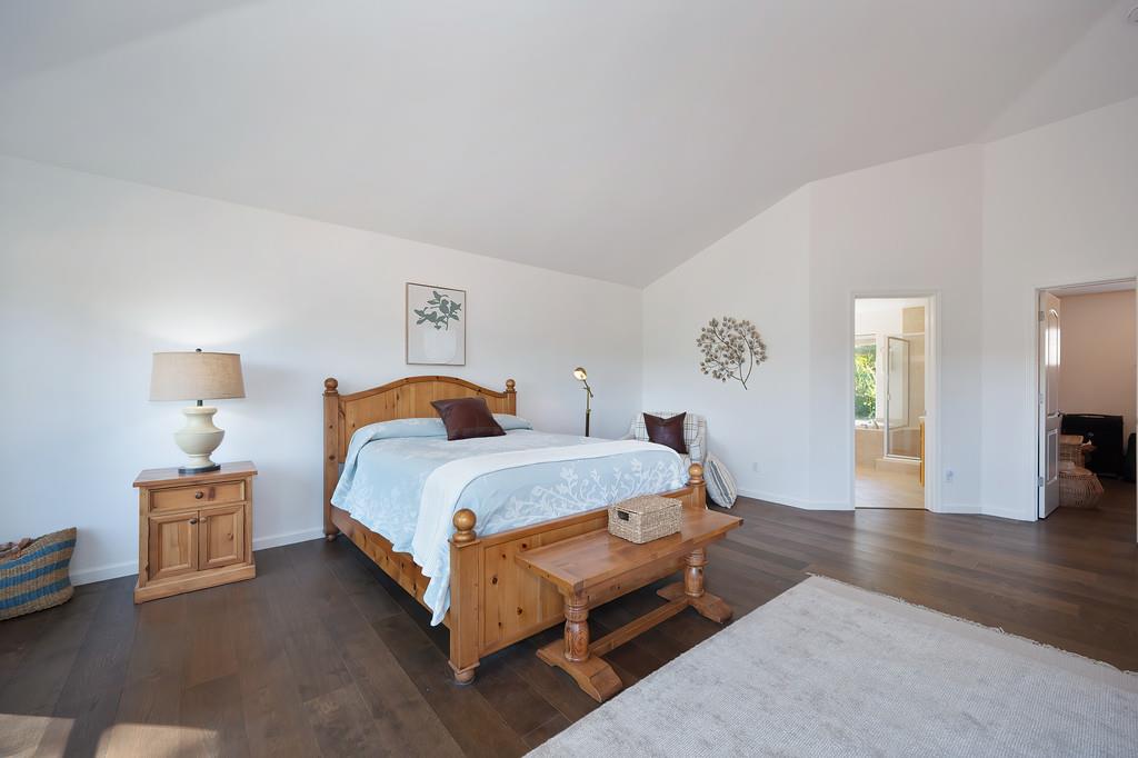 19676 Eagle Ridge Road Foresthill, CA 95631 - Photo 34 of 68 a spacious bedroom with a bed and wooden floor