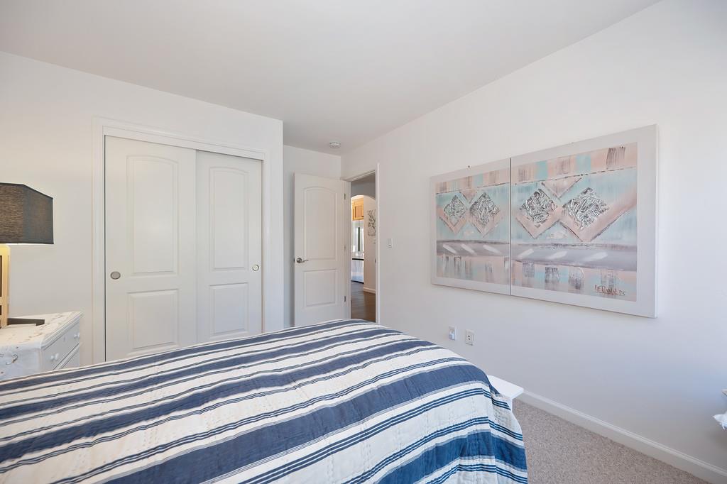 19676 Eagle Ridge Road Foresthill, CA 95631 - Photo 42 of 68 a bedroom with a bed and a painting on the wall