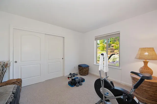 a view of a deck with chairs a barbeque with wooden floor and fence