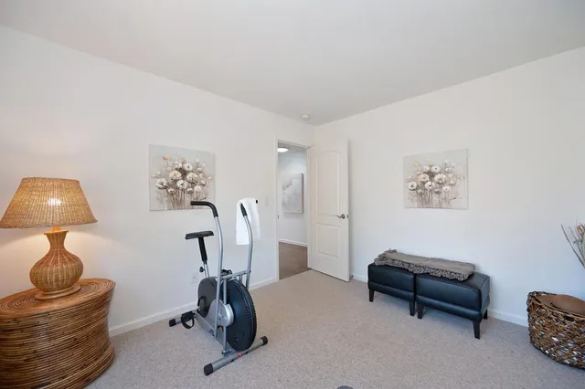 a view of a house with backyard sitting area and sitting area