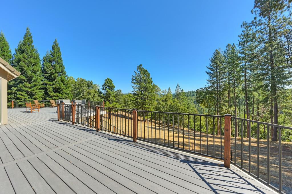 19676 Eagle Ridge Road Foresthill, CA 95631 - Photo 49 of 68 a view of a balcony with wooden floor and fence