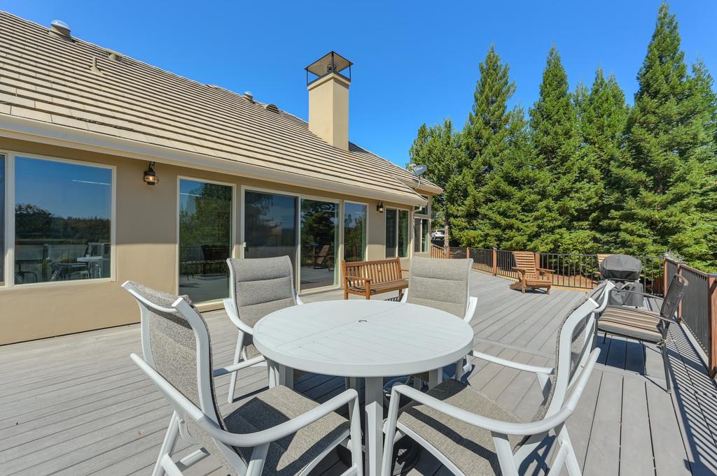 19676 Eagle Ridge Road Foresthill, CA 95631 - Photo 52 of 68 a view of a patio with table and chairs and potted plants