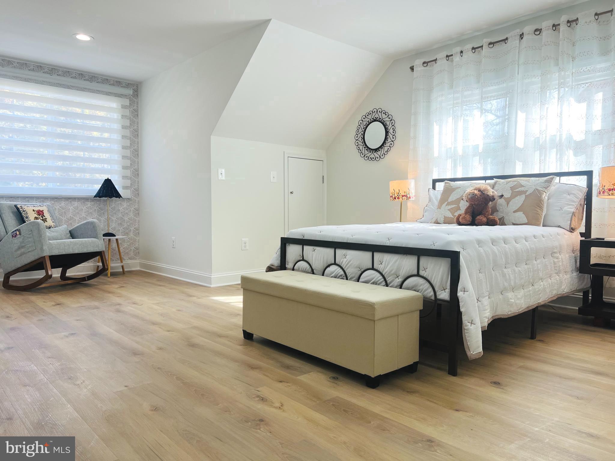 8802 2nd Avenue Silver Spring, MD 20910 - Photo 35 of 68 a spacious bedroom with a bed and a window