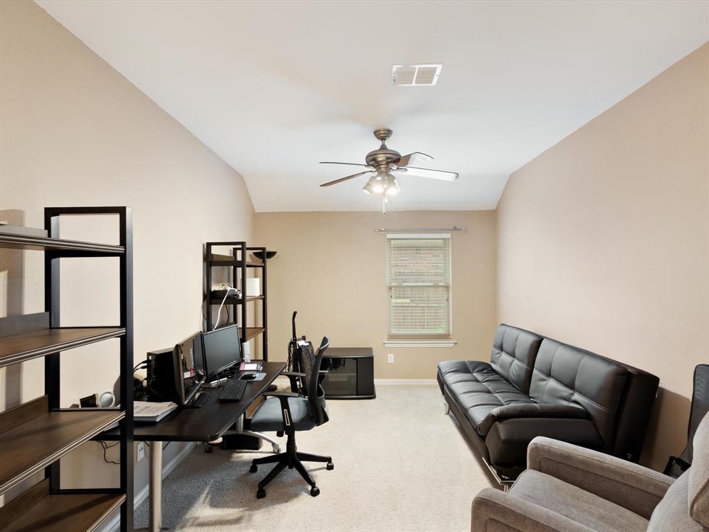 5440 Lavaca Road Grand Prairie, TX 75052 - Photo 9 of 22 Vaulted ceiling, ceiling fan with integrated lighting, window with blinds, and neutral wall tones