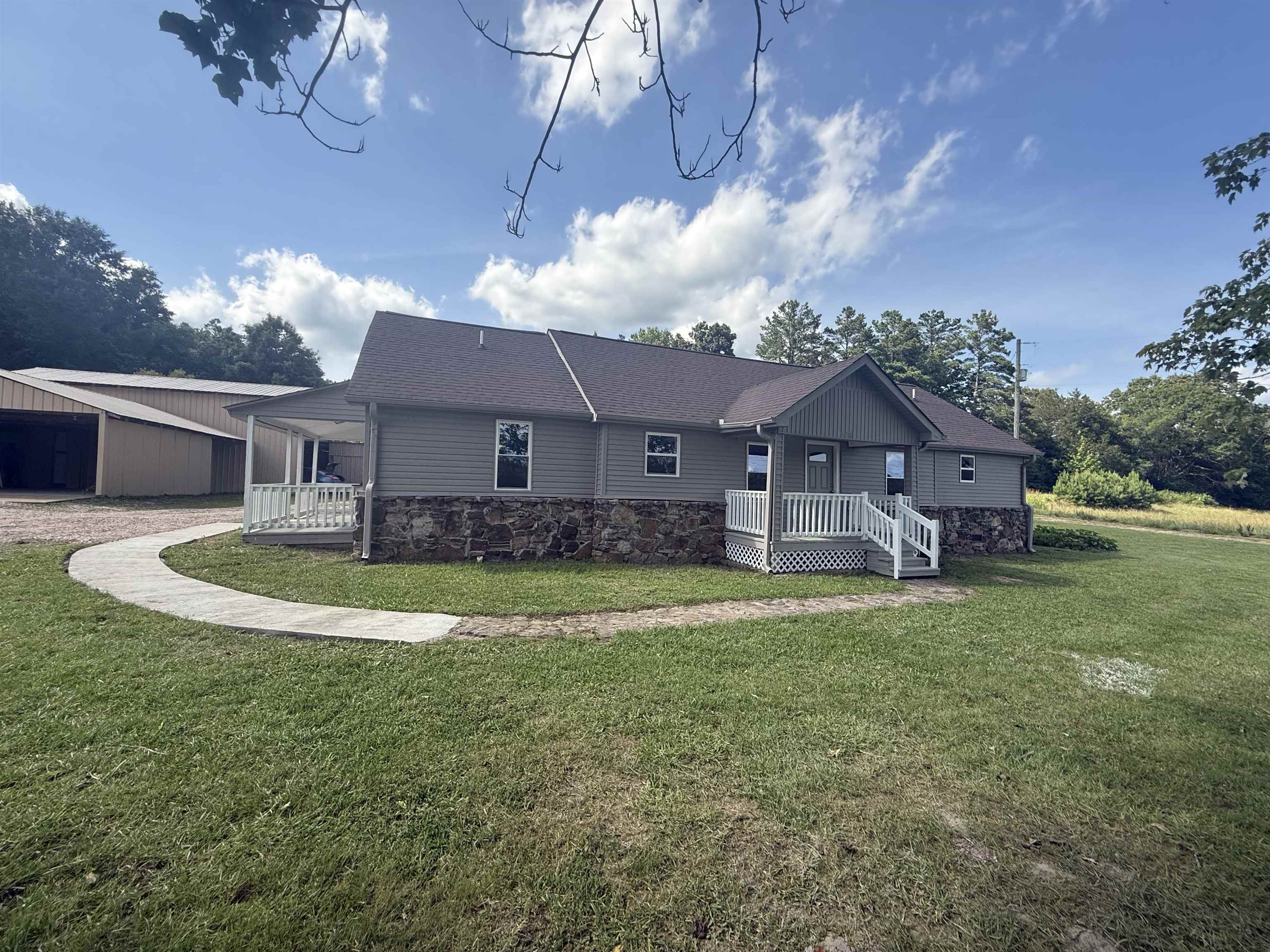 170 Leapwood Road Enville, TN 38332 - Photo 5 of 33 Ranch-style residence featuring grey siding and a stone-clad foundation