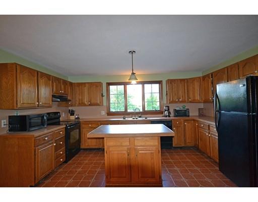 130 Upper Palmer Road Monson, MA 01057 - Photo 7 of 25 a kitchen with kitchen island granite countertop a sink stove and refrigerator