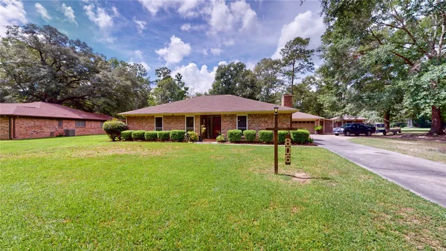 a swimming pool with outdoor seating and yard