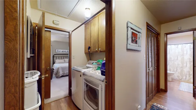 a view of a hallway and a livingroom with furniture