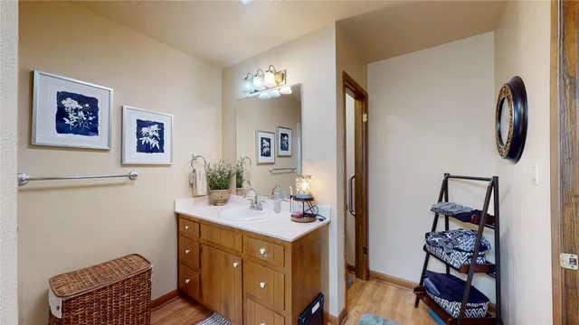a bathroom with a sink vanity and mirror