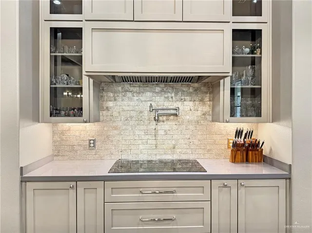 a kitchen with a sink and cabinets