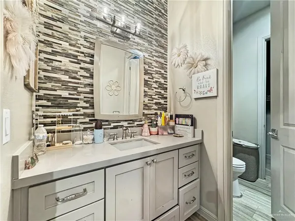a bathroom with a sink and a mirror