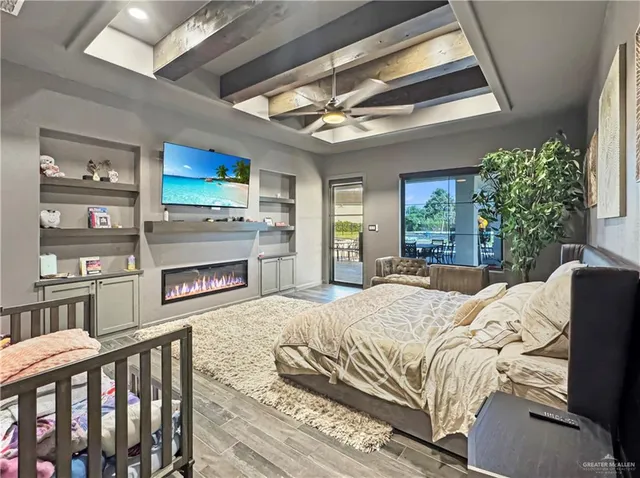 a bedroom with a bed and a fireplace