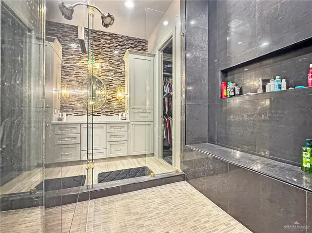a bathroom with a shower and a bathtub