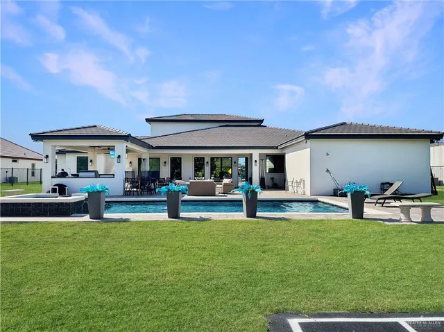 a view of a house with a yard porch and sitting area