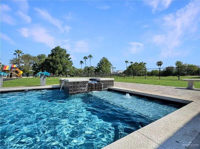 a view of a garden with sitting area