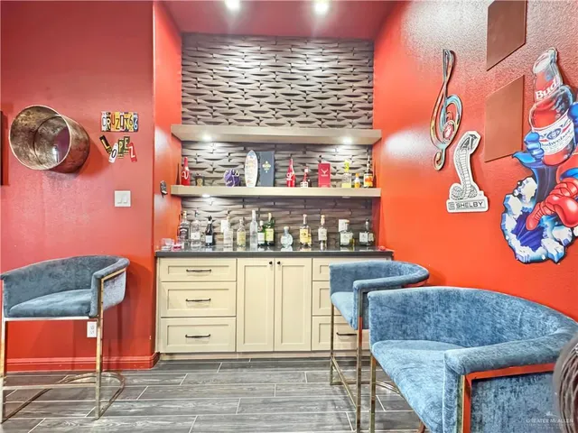 a kitchen with stainless steel appliances granite countertop a stove and a refrigerator
