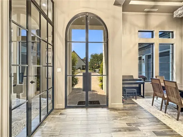 a view of front door door and dining room