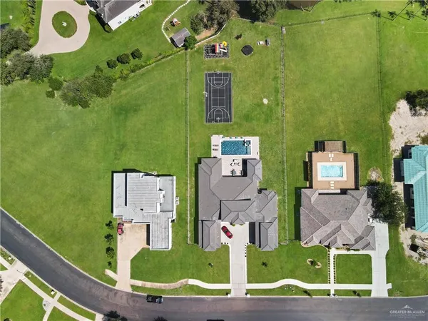 an aerial view of a house with a swimming pool