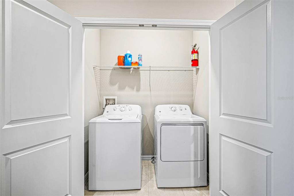 31945 Blue Passing Loop Wesley Chapel, FL 33545 - Photo 12 of 22 a utility room with dryer and washer