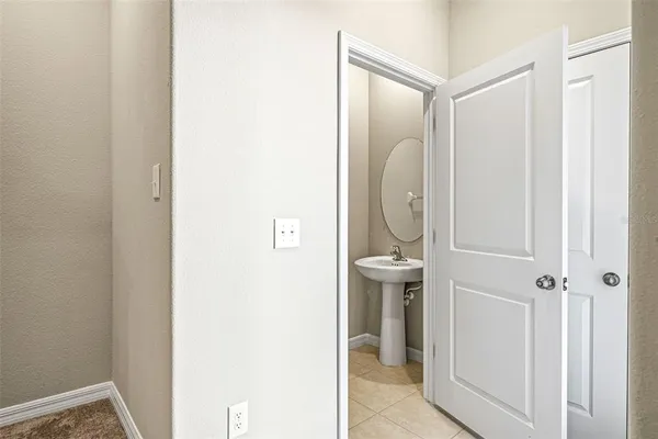 a bathroom with a glass shower door and mirror