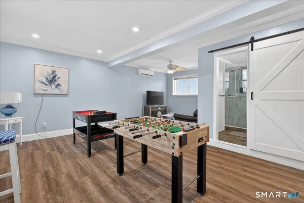 a view of a dining room with furniture and wooden floor