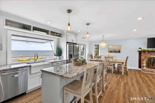 a kitchen with lots of counter top space and dining table