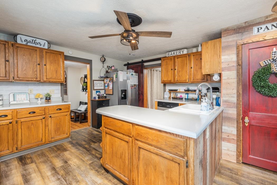 588 Concord Church Road Timberville, VA 22853 - Photo 1 of 32 a kitchen with stainless steel appliances granite countertop a sink a stove and a refrigerator