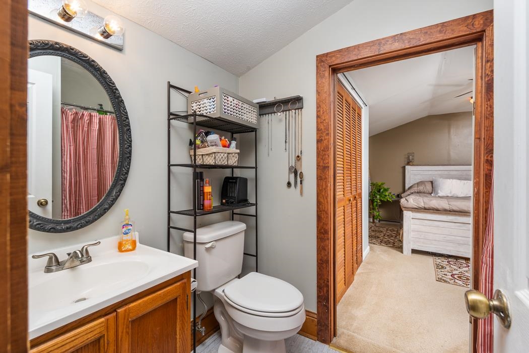 588 Concord Church Road Timberville, VA 22853 - Photo 15 of 32 a bathroom with a toilet sink and mirror