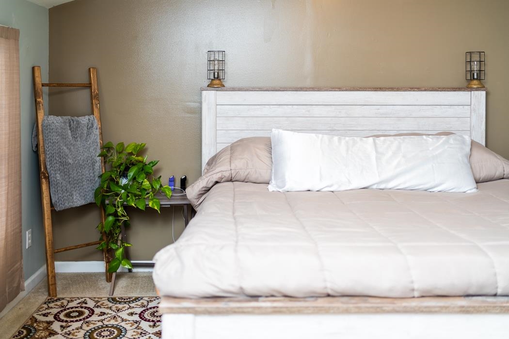 588 Concord Church Road Timberville, VA 22853 - Photo 16 of 32 a white bed with a potted plant