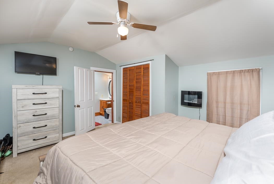 588 Concord Church Road Timberville, VA 22853 - Photo 18 of 32 a bedroom with a bed and a flat screen tv