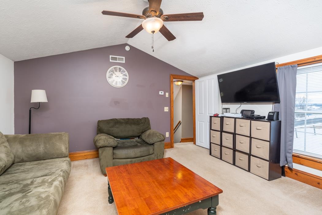 588 Concord Church Road Timberville, VA 22853 - Photo 20 of 32 a bedroom with furniture and a flat screen tv